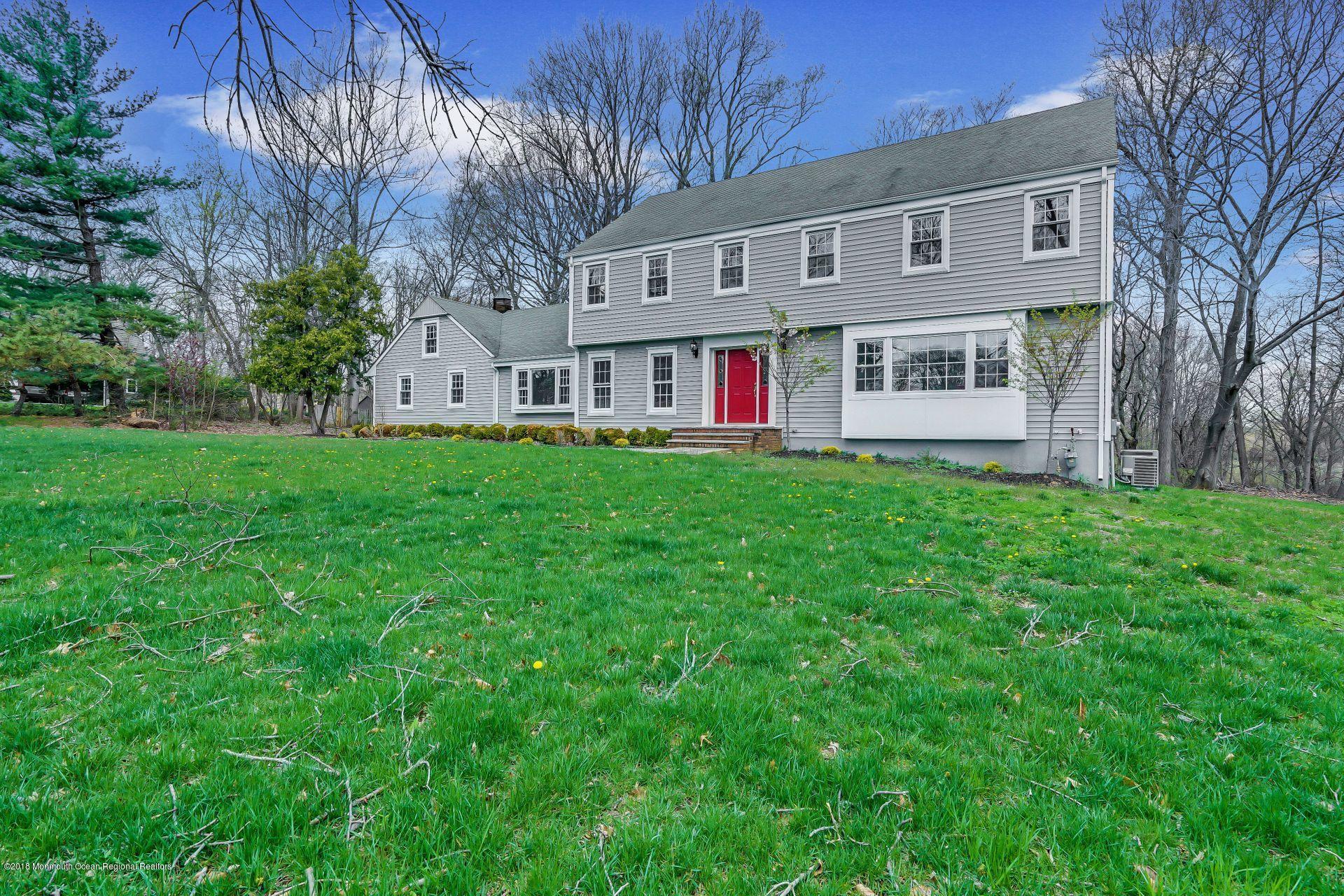 8 Saddle Ridge Road Colts Neck, NJ 07722 - Photo 28 of 35 a front view of house with yard and green space