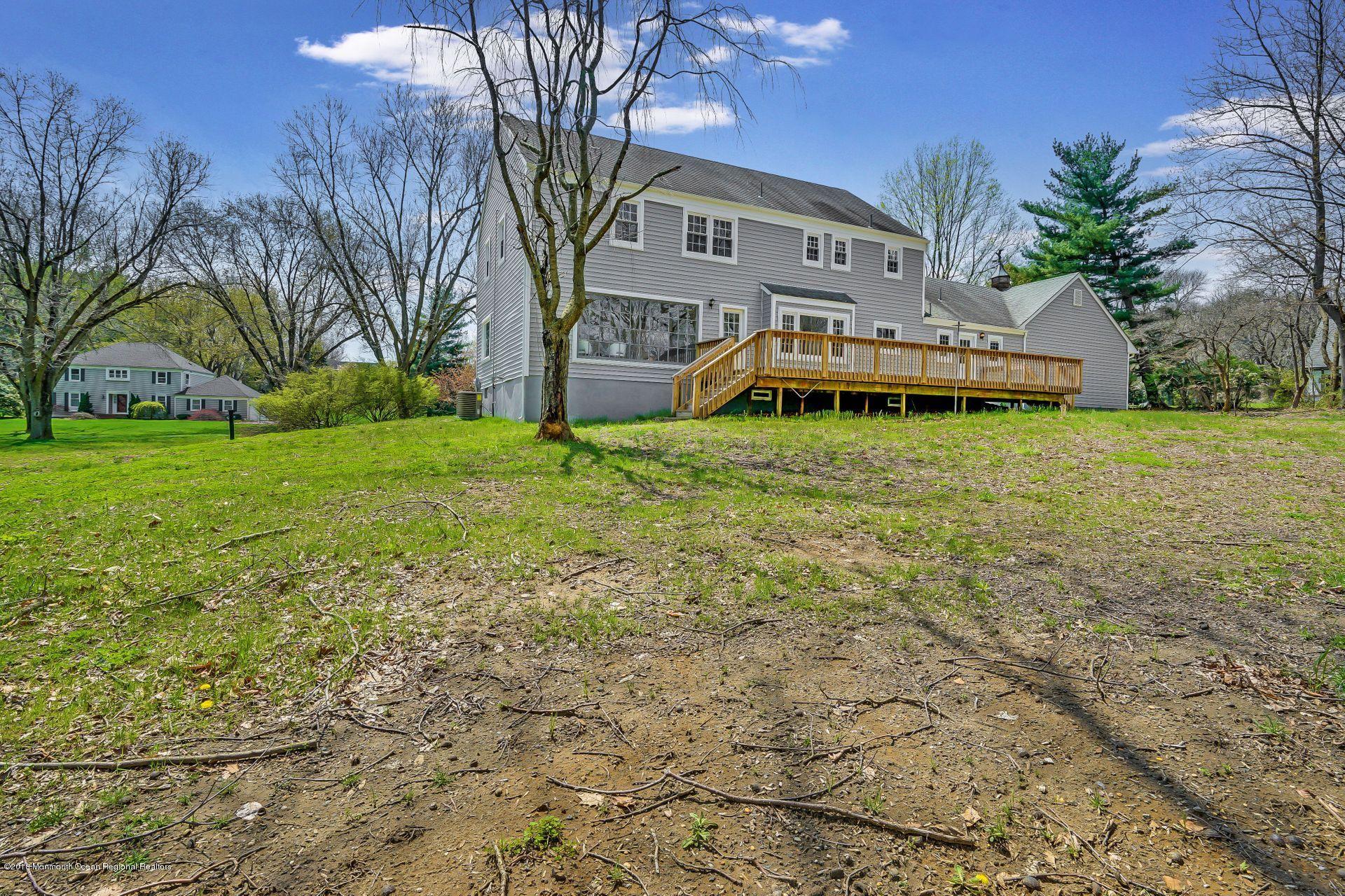 8 Saddle Ridge Road Colts Neck, NJ 07722 - Photo 33 of 35 a front view of house with yard and trees