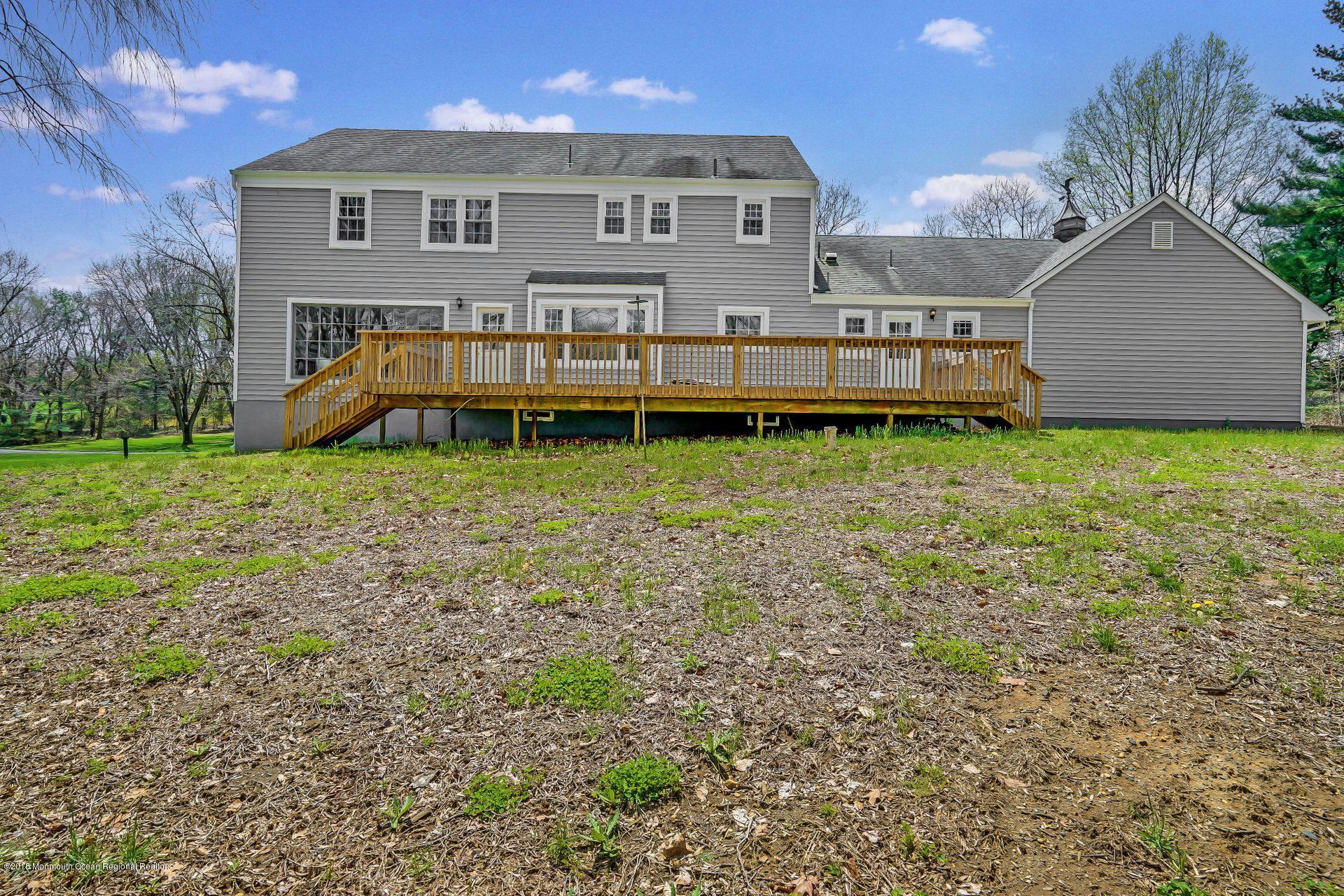 8 Saddle Ridge Road Colts Neck, NJ 07722 - Photo 35 of 35 a view of a house with backyard and sitting area