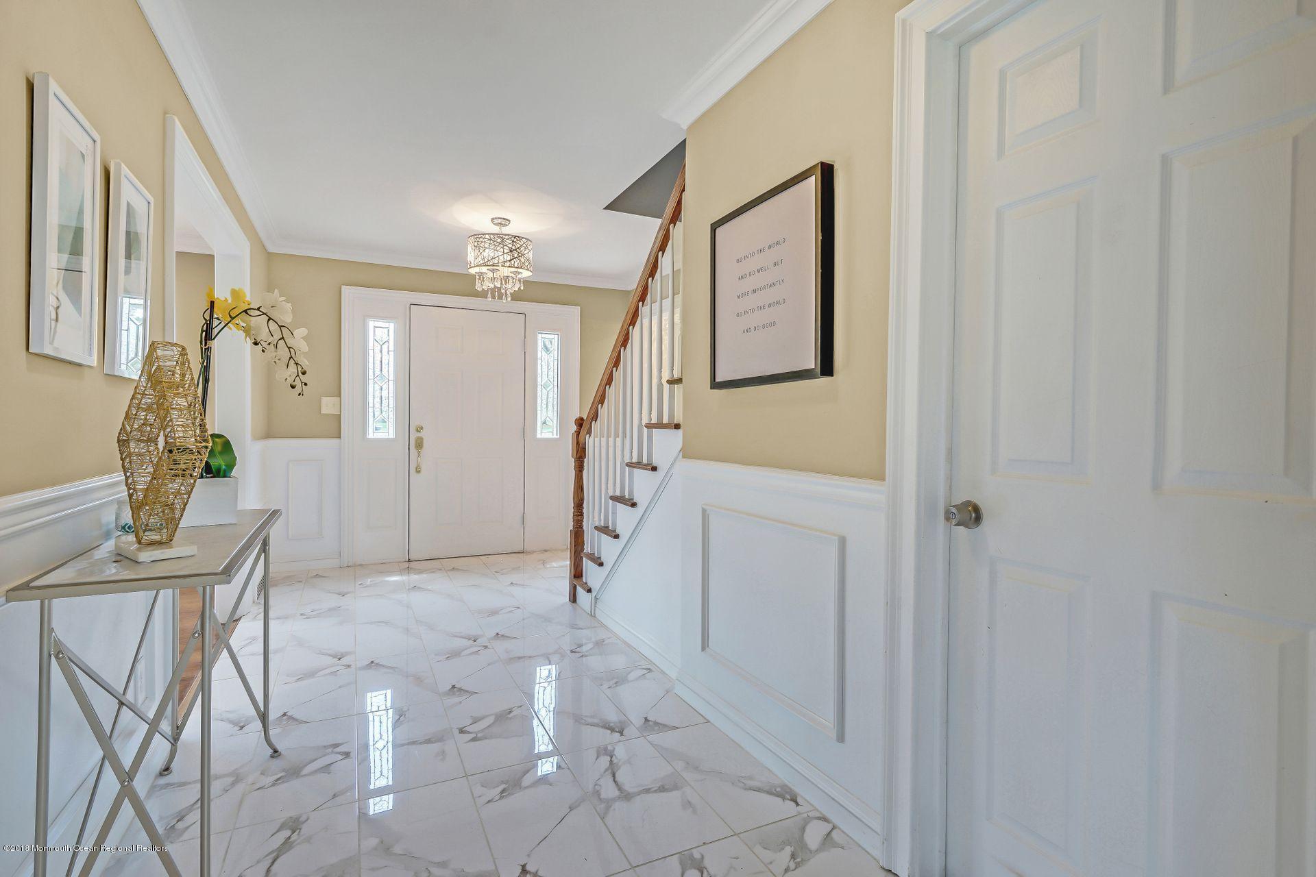 8 Saddle Ridge Road Colts Neck, NJ 07722 - Photo 6 of 35 a view of a livingroom with furniture and stairs