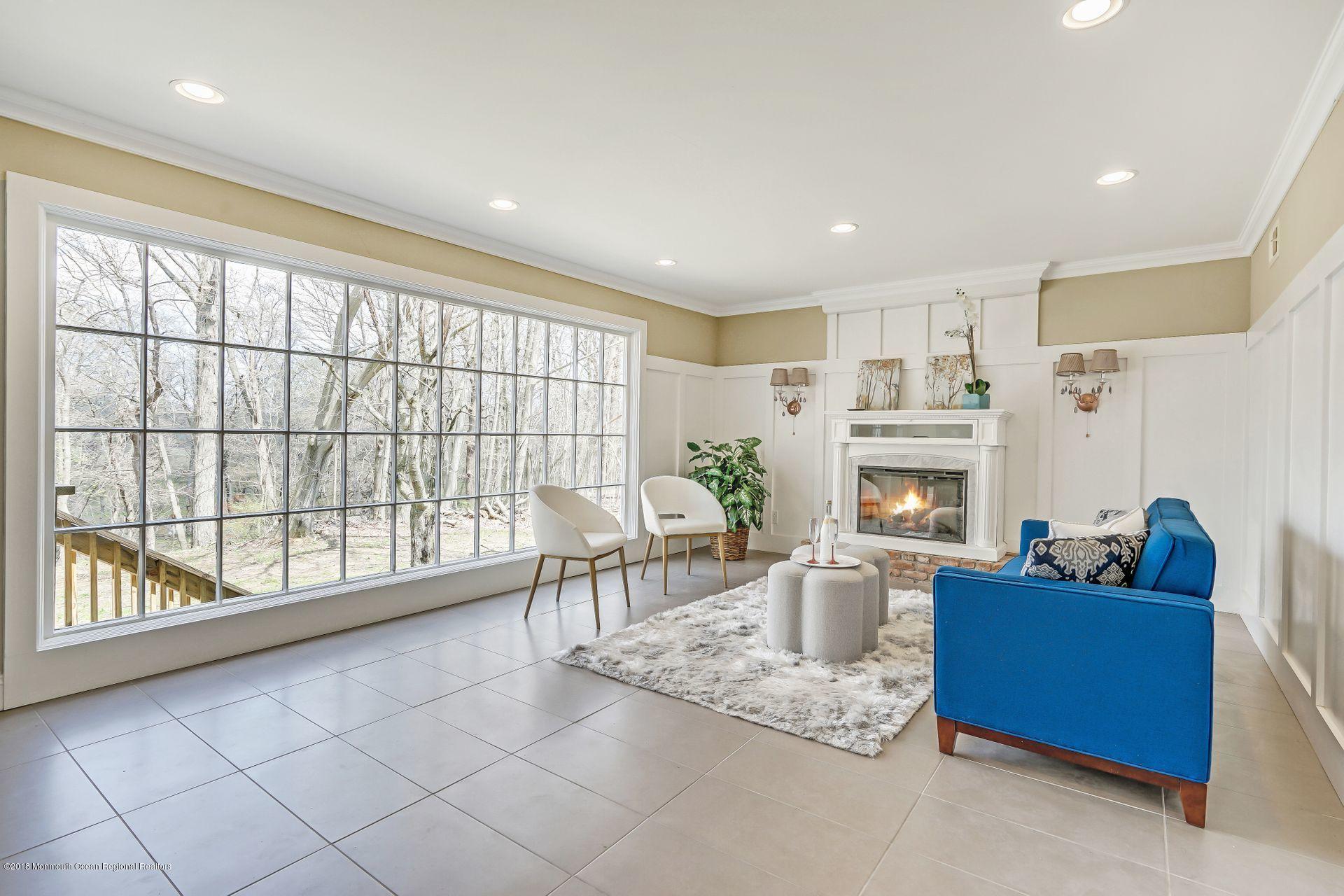 8 Saddle Ridge Road Colts Neck, NJ 07722 - Photo 8 of 35 a living room with furniture and a large window