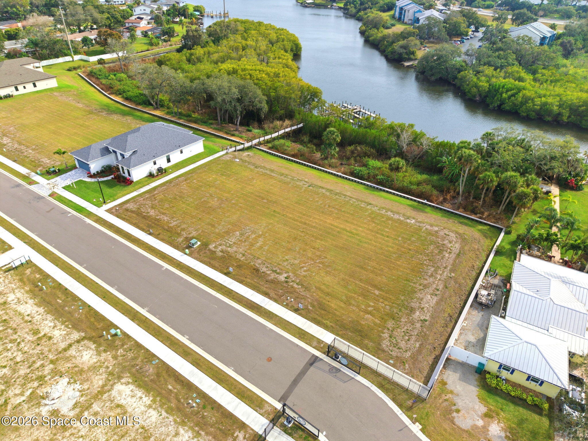 1415 Windchime Lane Melbourne, FL 32935 - Photo 7 of 8 an aerial view of a tennis court