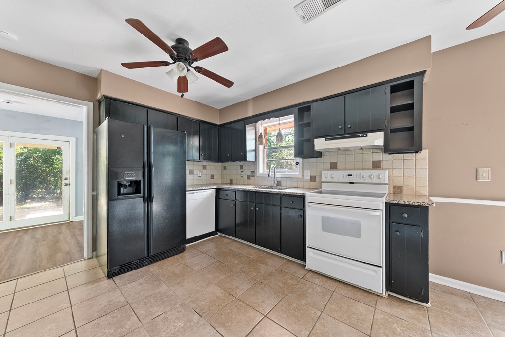 6263 Potomac Circle Columbus, GA 31909 - Photo 11 of 31 a kitchen with a refrigerator a sink and dishwasher
