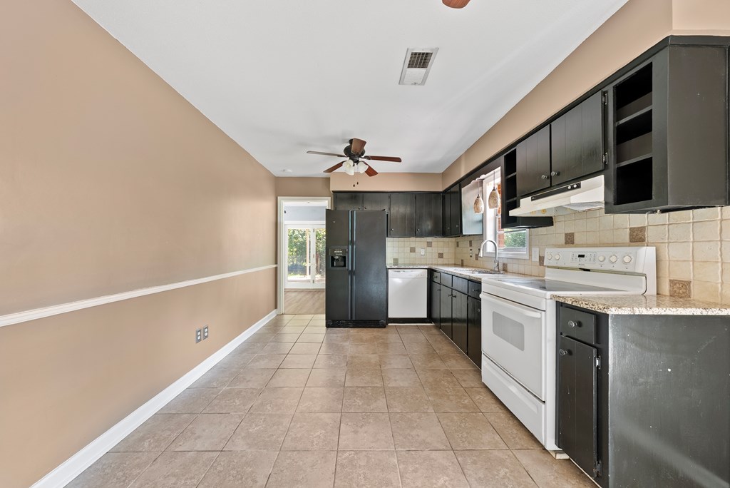 6263 Potomac Circle Columbus, GA 31909 - Photo 12 of 31 a kitchen with a sink cabinets and stainless steel appliances