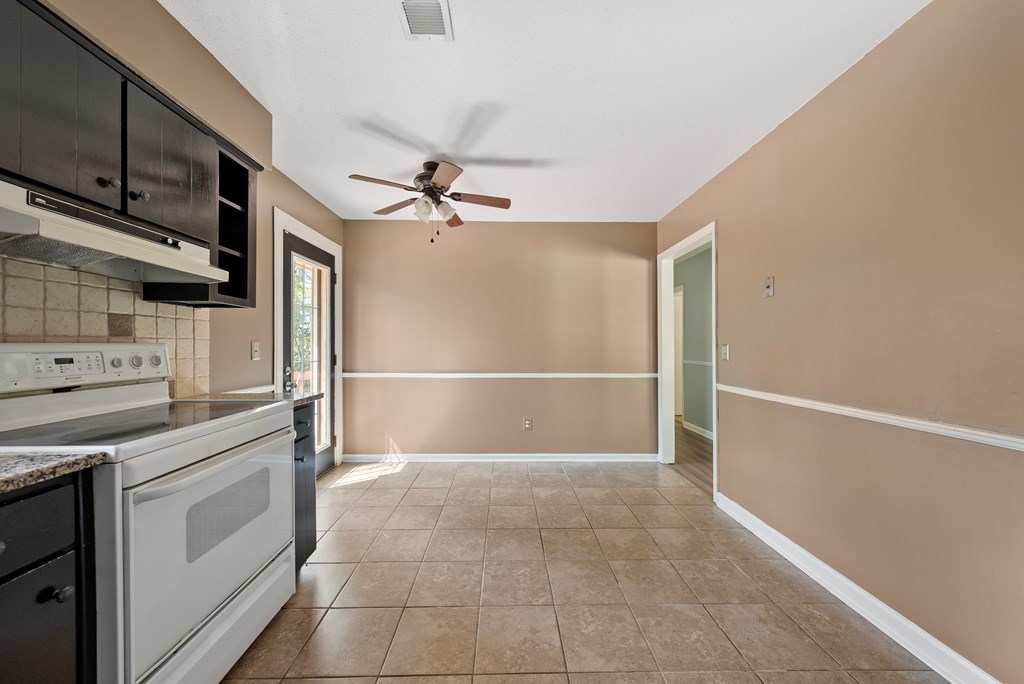 6263 Potomac Circle Columbus, GA 31909 - Photo 14 of 31 a view of a kitchen with refrigerator and microwave