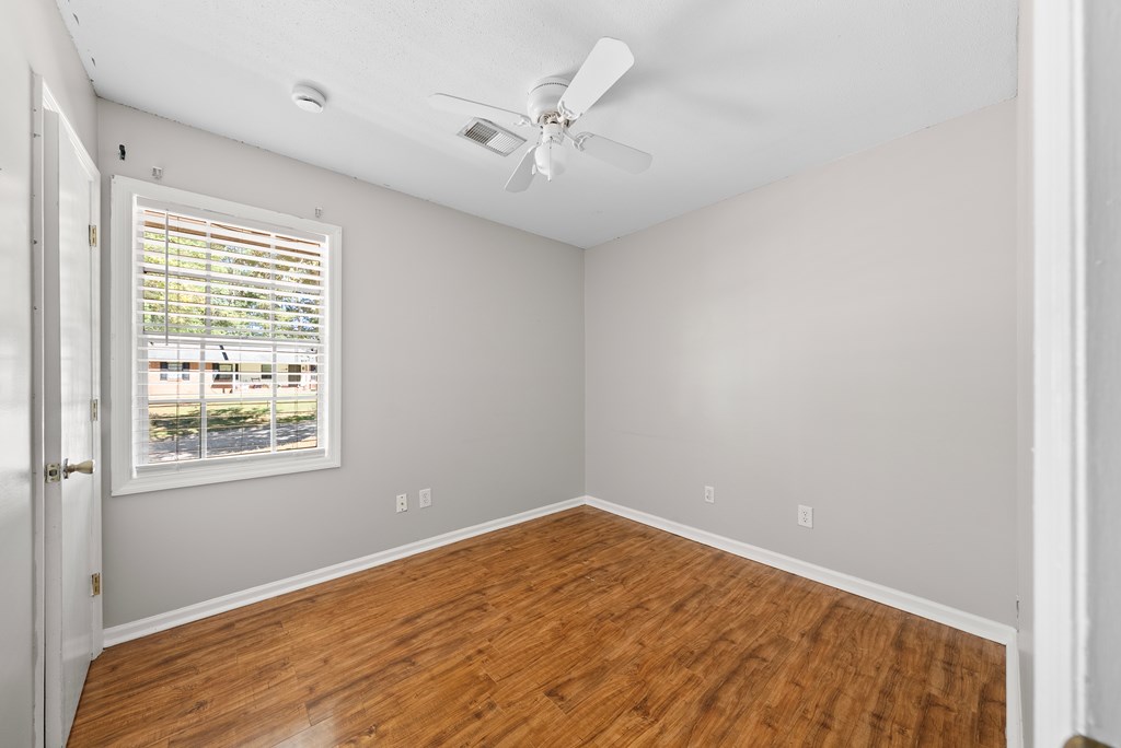 6263 Potomac Circle Columbus, GA 31909 - Photo 15 of 31 an empty room with a window and a ceiling fan