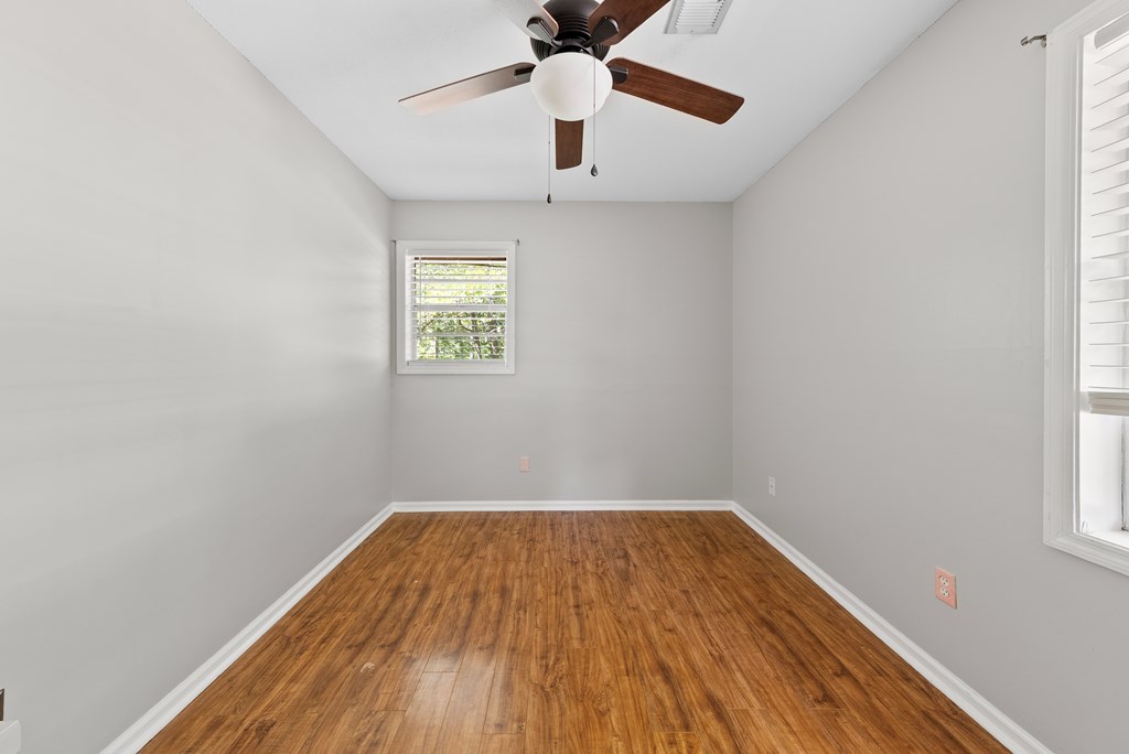 6263 Potomac Circle Columbus, GA 31909 - Photo 23 of 31 an empty room with a window and a ceiling fan