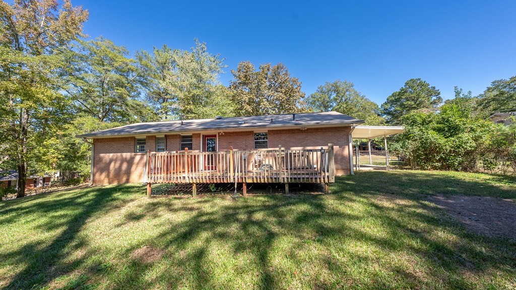 6263 Potomac Circle Columbus, GA 31909 - Photo 29 of 31 a backyard of a house with yard table and chairs