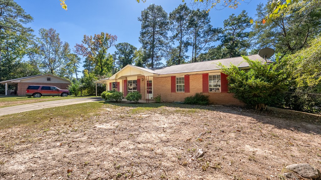 6263 Potomac Circle Columbus, GA 31909 - Photo 3 of 31 a house with trees in the background
