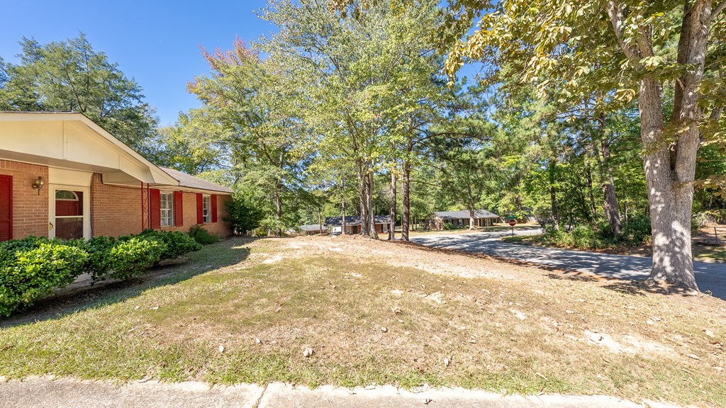 6263 Potomac Circle Columbus, GA 31909 - Photo 5 of 31 a view of a yard with plants and trees