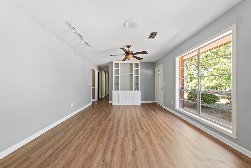 6263 Potomac Circle Columbus, GA 31909 - Photo 7 of 31 wooden floor in an empty room with a window