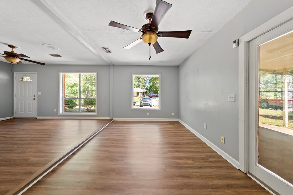 6263 Potomac Circle Columbus, GA 31909 - Photo 9 of 31 wooden floor in an empty room with a window