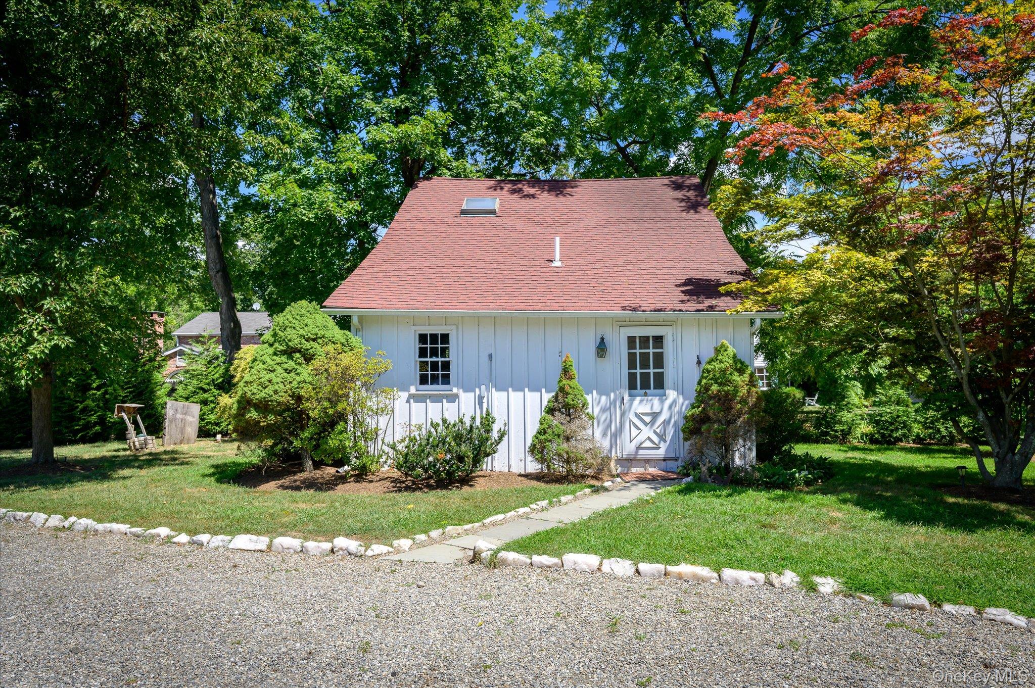 459 Old Post Road Bedford, NY 10506 - Photo 2 of 24 a front view of a house with a yard and porch