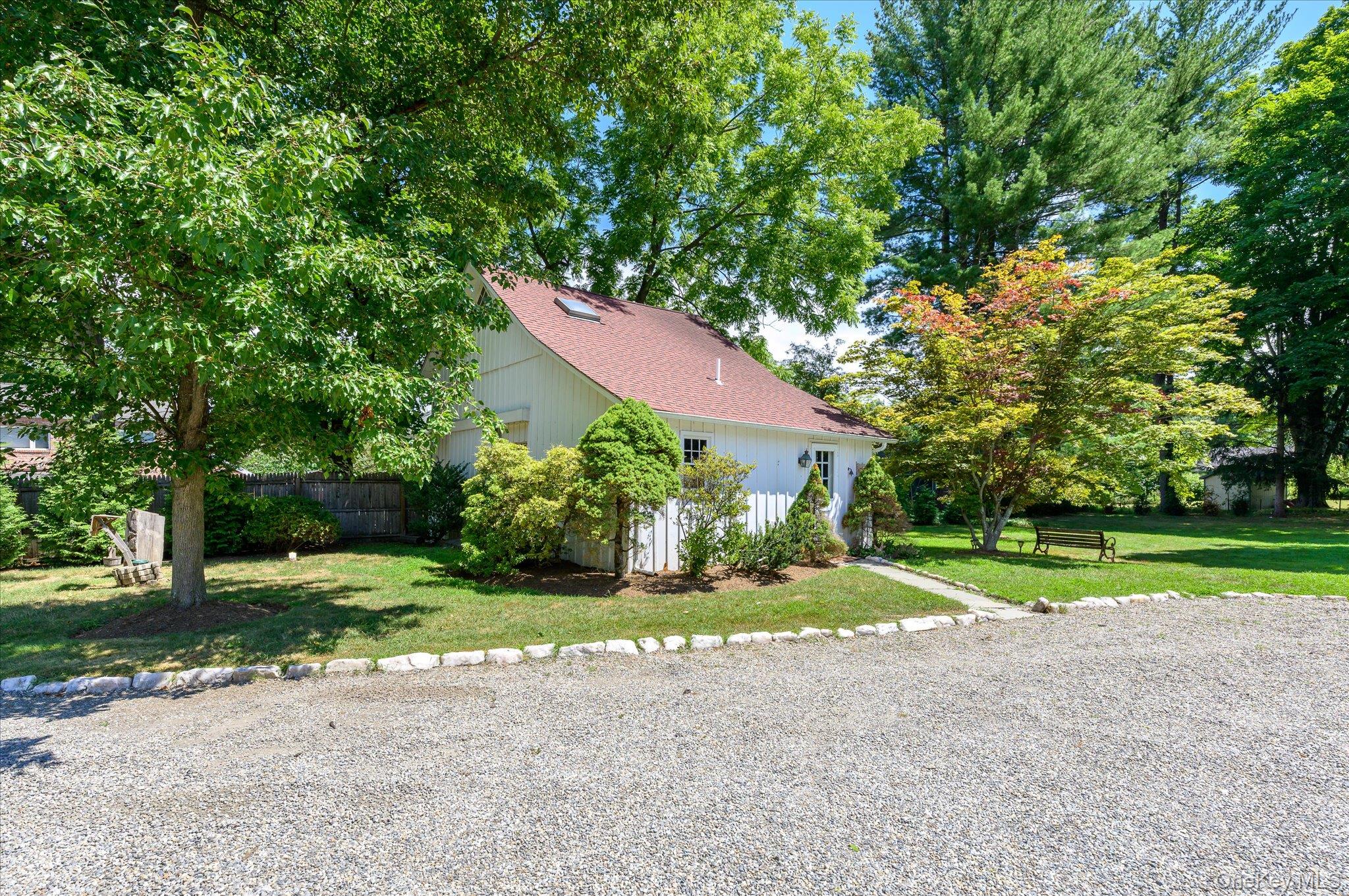 459 Old Post Road Bedford, NY 10506 - Photo 3 of 24 a view of a house with a yard and large trees