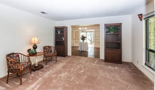 a view of a livingroom with furniture and windows