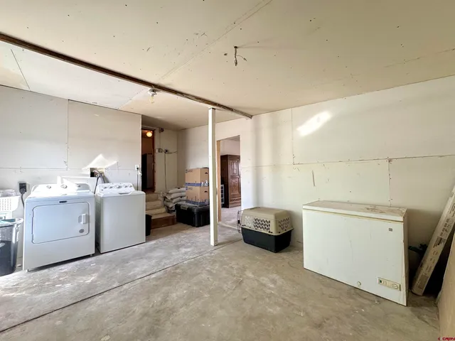 a view of utility room and closet
