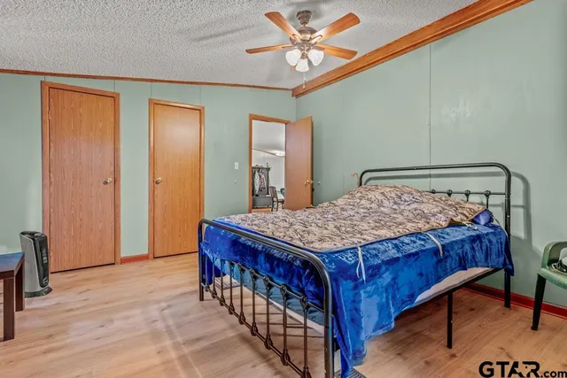 a bedroom with a bed and a table