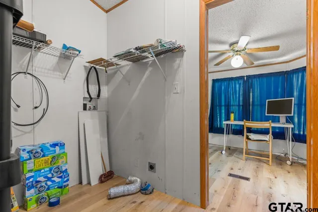 a view of a dining room with a table and chairs