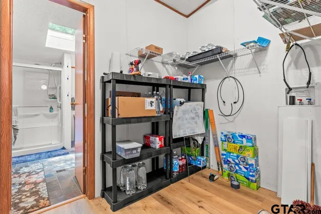 a view of living room and wooden floor