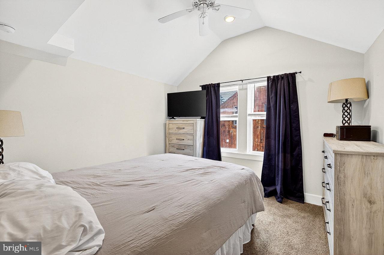 512 Spruce Street Delanco, NJ 08075 - Photo 15 of 24 a bedroom with a large bed and a flat tv screen on dresser