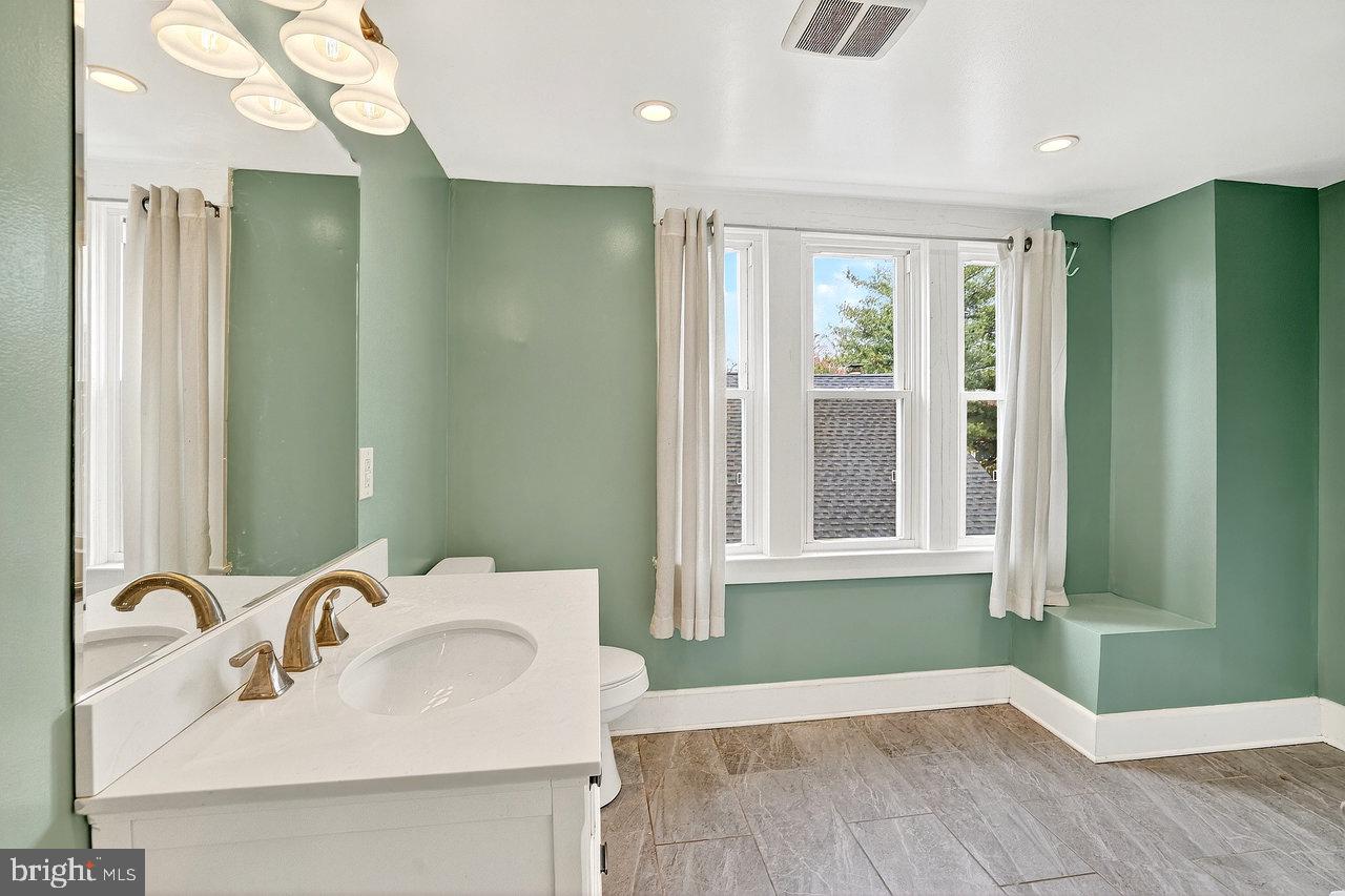 512 Spruce Street Delanco, NJ 08075 - Photo 18 of 24 a bathroom with a sink and a mirror