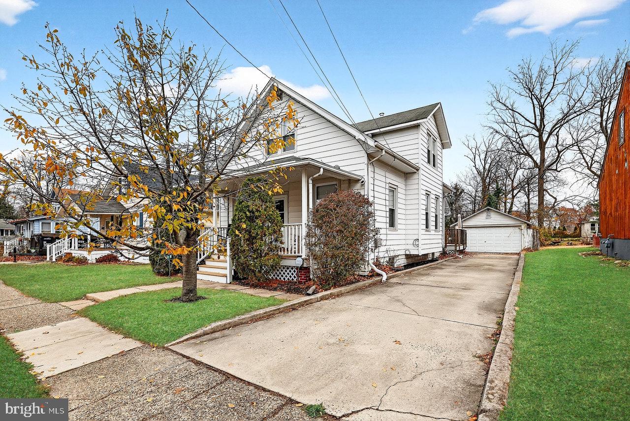 512 Spruce Street Delanco, NJ 08075 - Photo 2 of 24 a white house that has tree in front of it