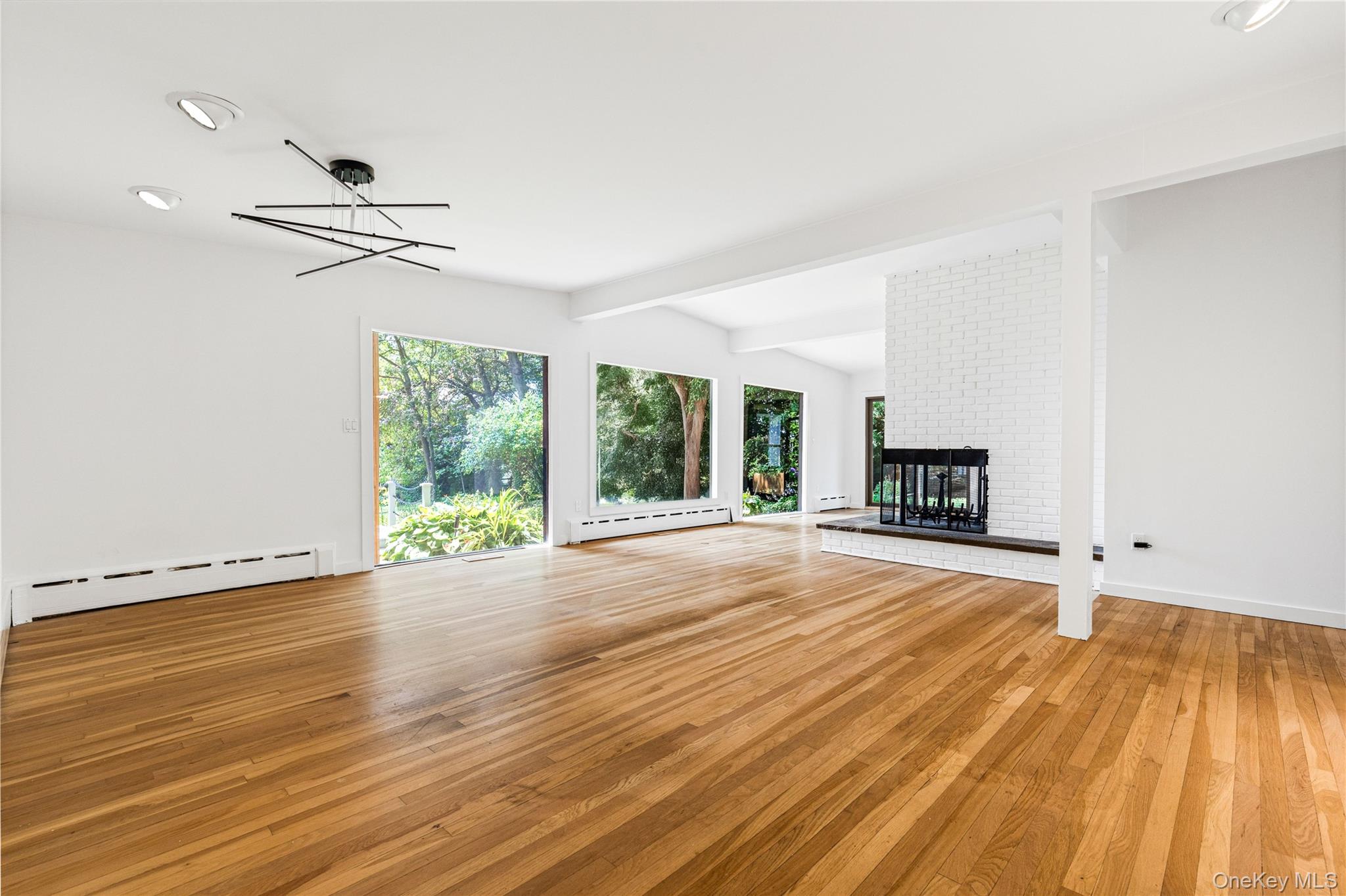 1160 Greacen Point Road Mamaroneck, NY 10543 - Photo 15 of 45 Open-plan Living and Dining Rooms
