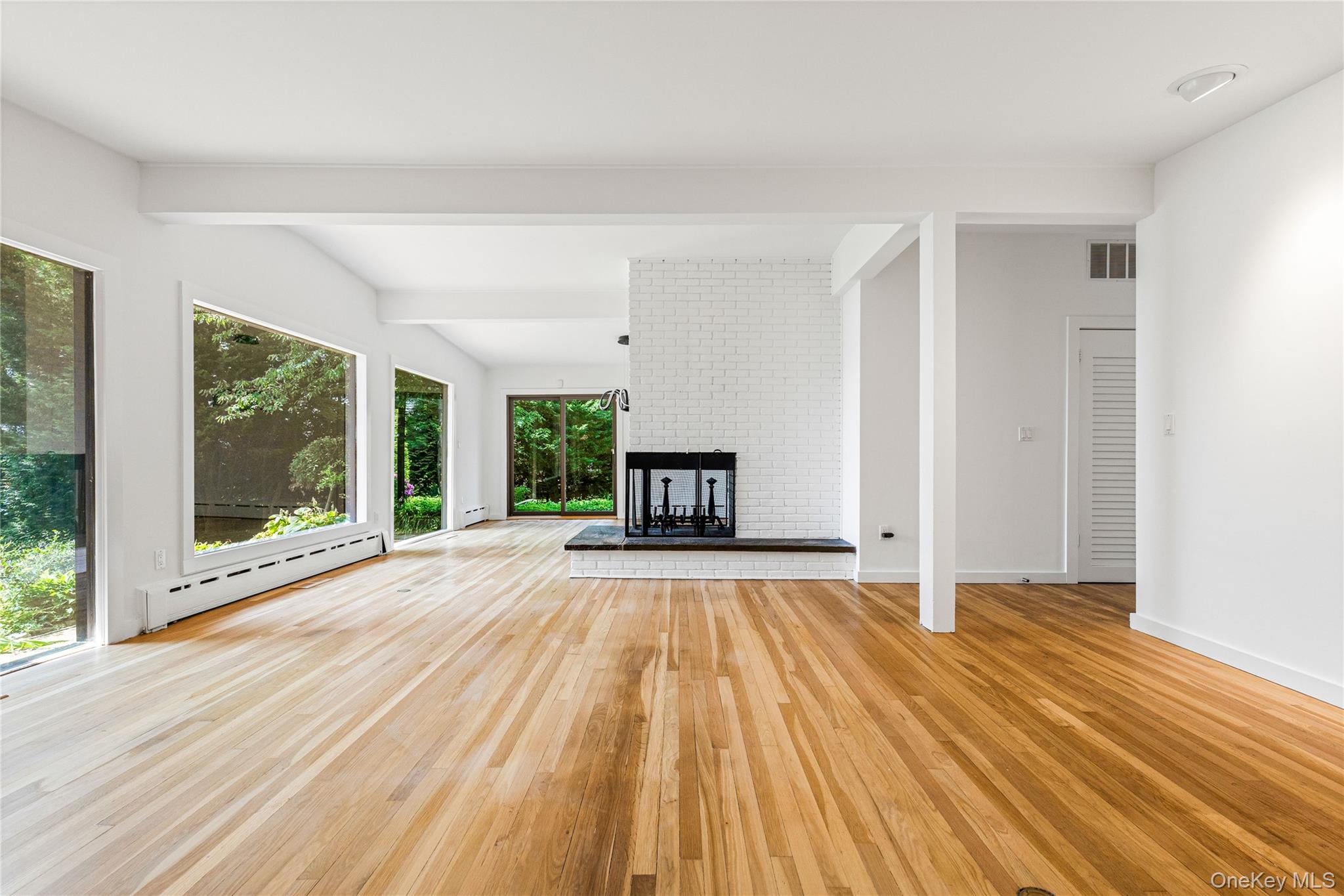 1160 Greacen Point Road Mamaroneck, NY 10543 - Photo 16 of 45 Oversized windows bring in the outside in