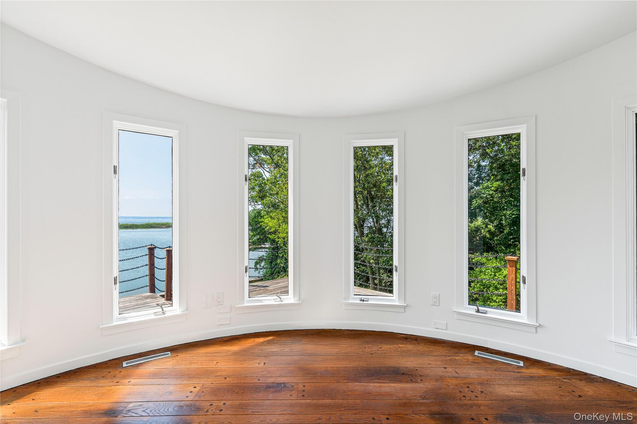 1160 Greacen Point Road Mamaroneck, NY 10543 - Photo 34 of 45 Curved Sunroom with views of the second floor deck