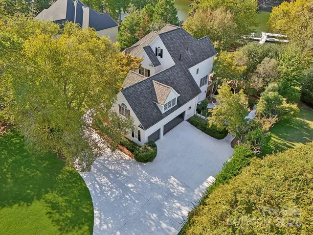 a view of a house with a yard and garden