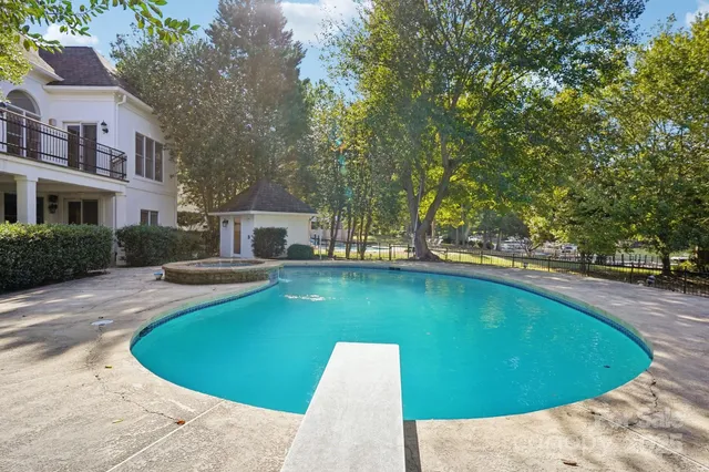 a view of a swimming pool with a patio