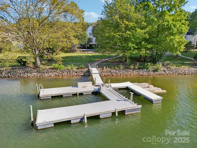 a view of a wooden bench sitting in the lake
