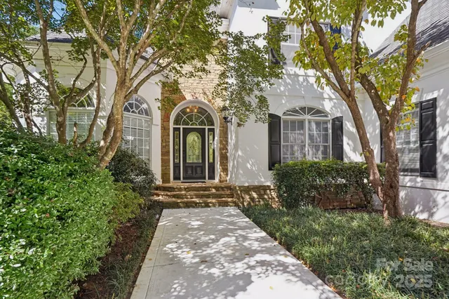 front view of a house with a garden