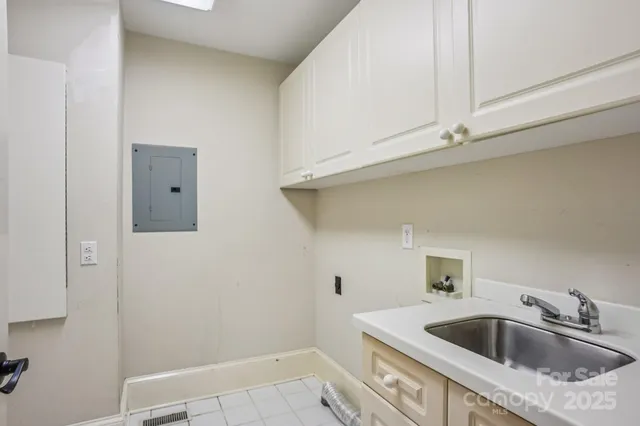 an aerial view of a house with outdoor space and lake view