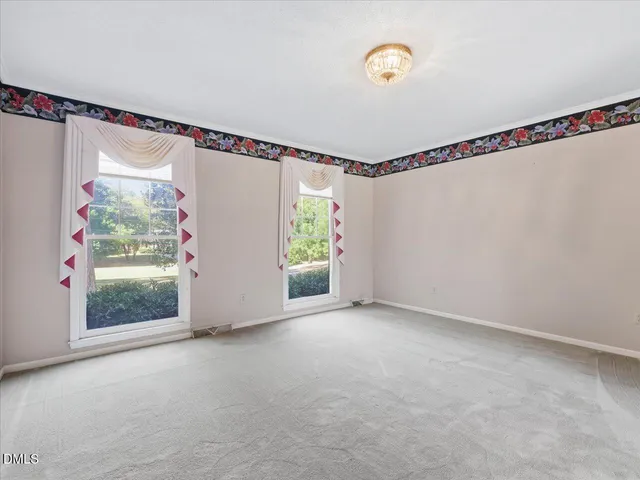 a kitchen with granite countertop a stove sink and cabinets