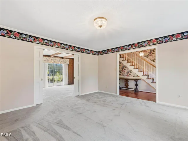 a view of a refrigerator in kitchen and wooden floor