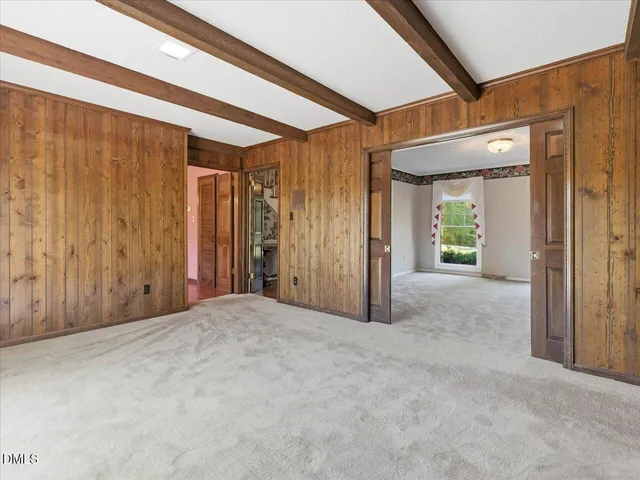 a view of an empty room with a dresser