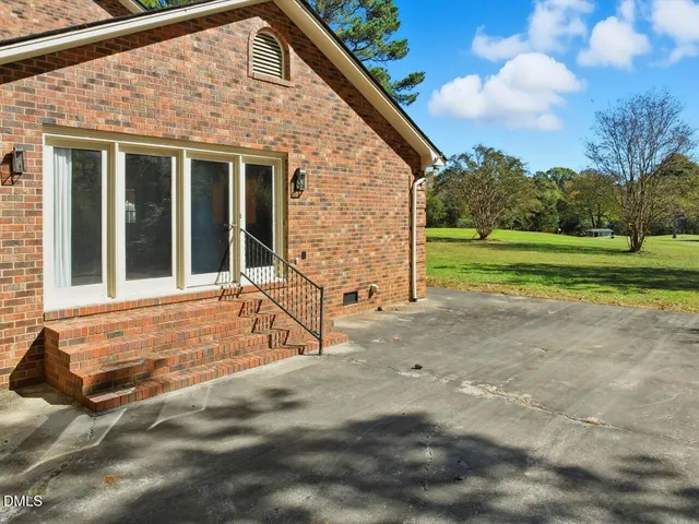 a view of field with trees in the background
