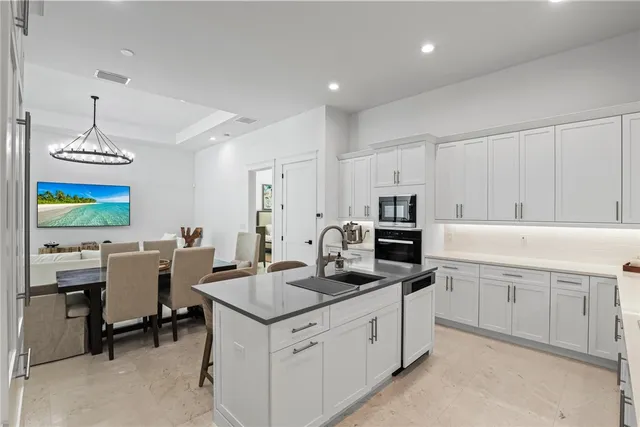 a kitchen with sink cabinets and microwave