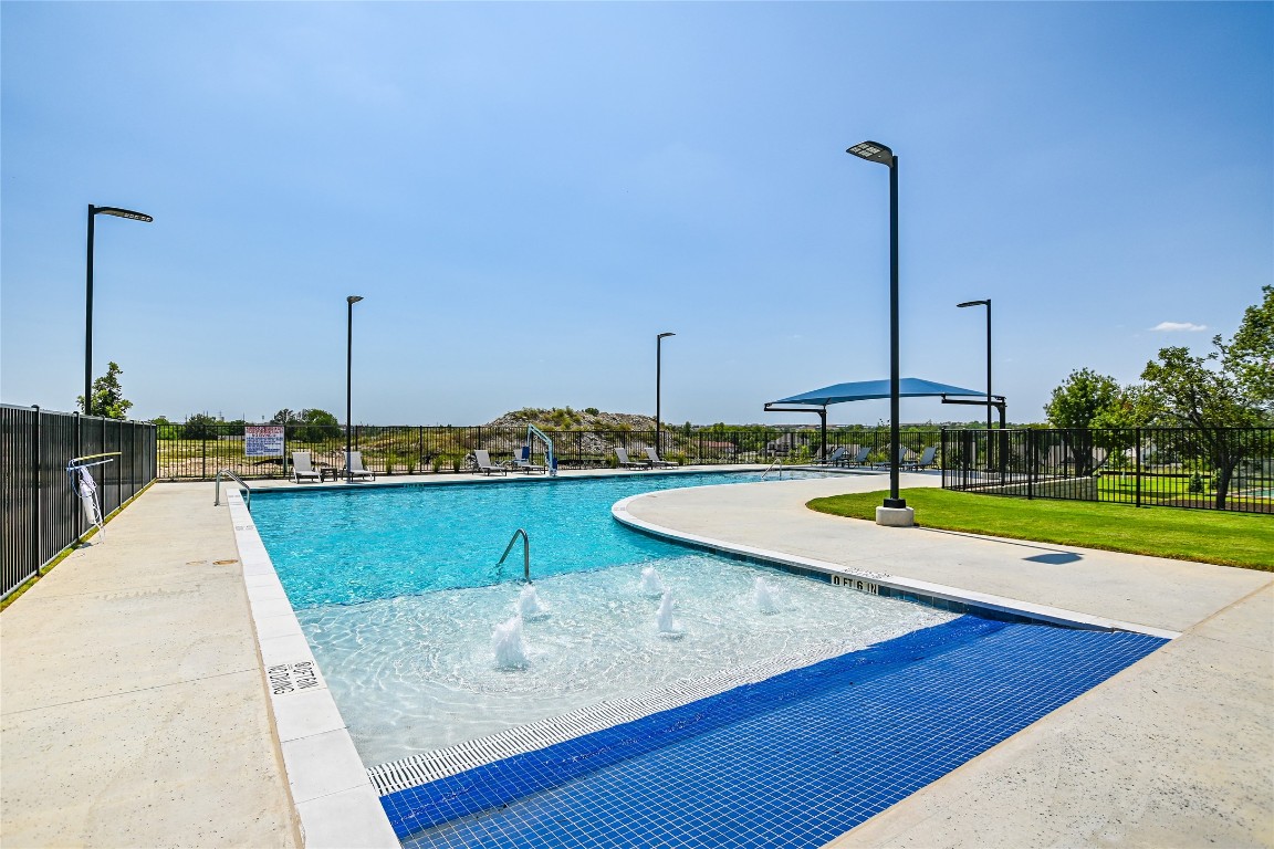 805 Nadal Path Round Rock, TX 78664 - Photo 9 of 17 a view of a swimming pool with a lake