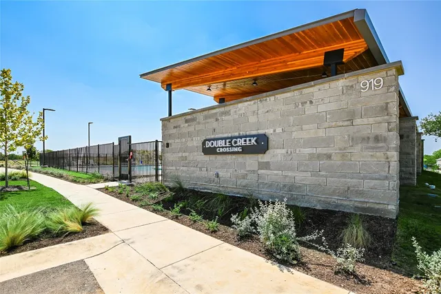 a sign board on the side of a building