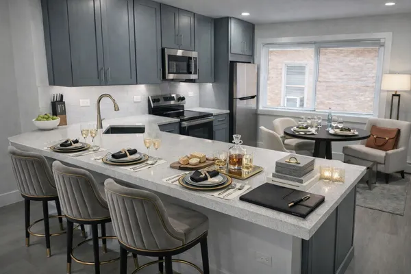 a kitchen with a dining table and chairs