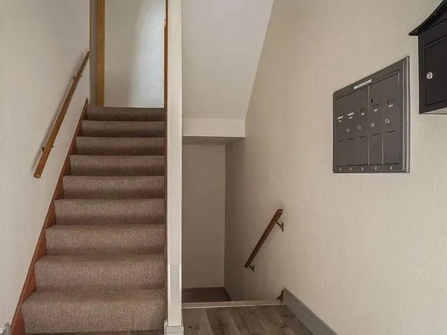 a view of staircase with white walls