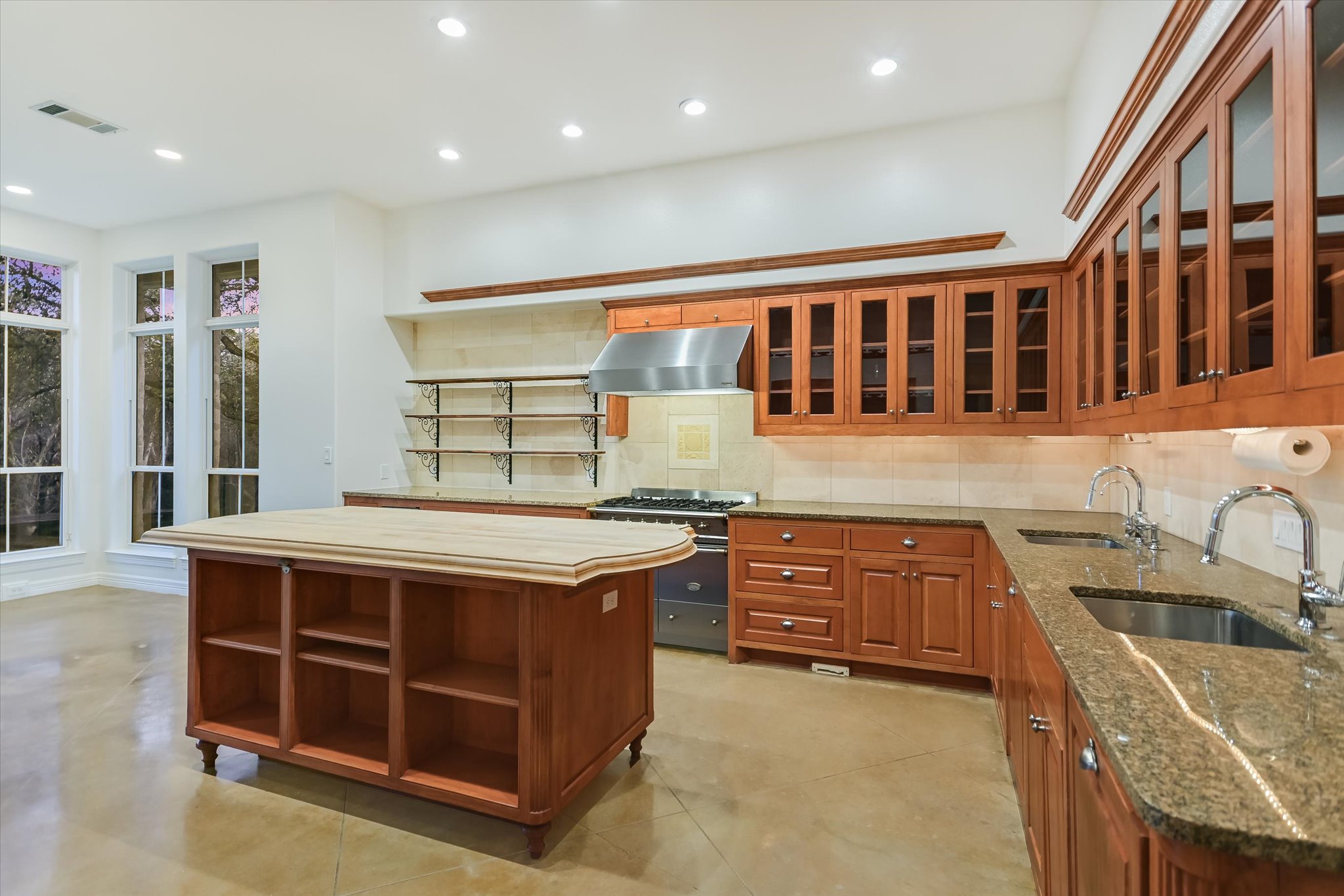 4501 House Of Lancaster Austin, TX 78730 - Photo 11 of 36 a kitchen with stainless steel appliances granite countertop a stove and a sink