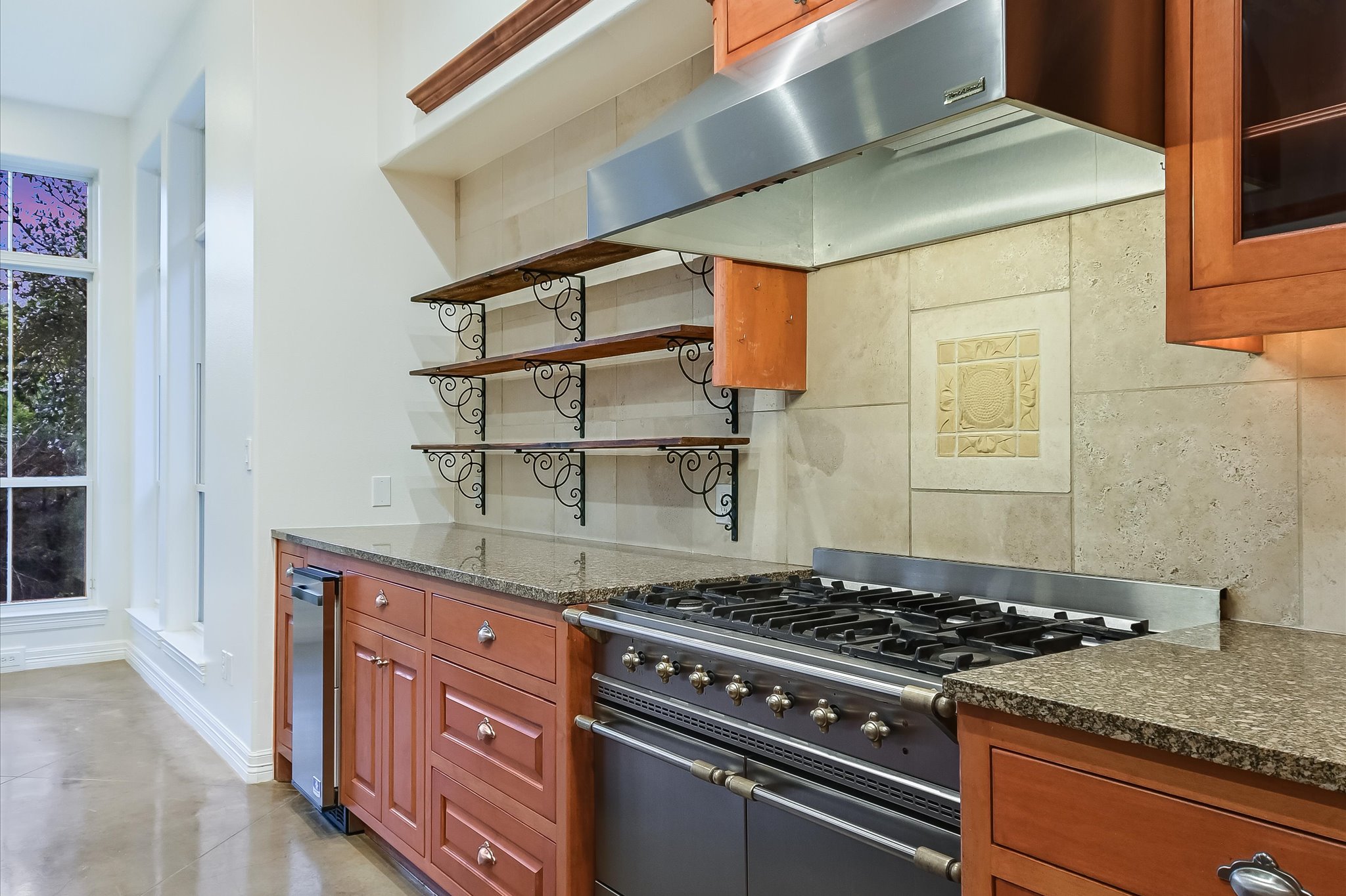 4501 House Of Lancaster Austin, TX 78730 - Photo 12 of 36 a kitchen with stainless steel appliances granite countertop a stove and a sink