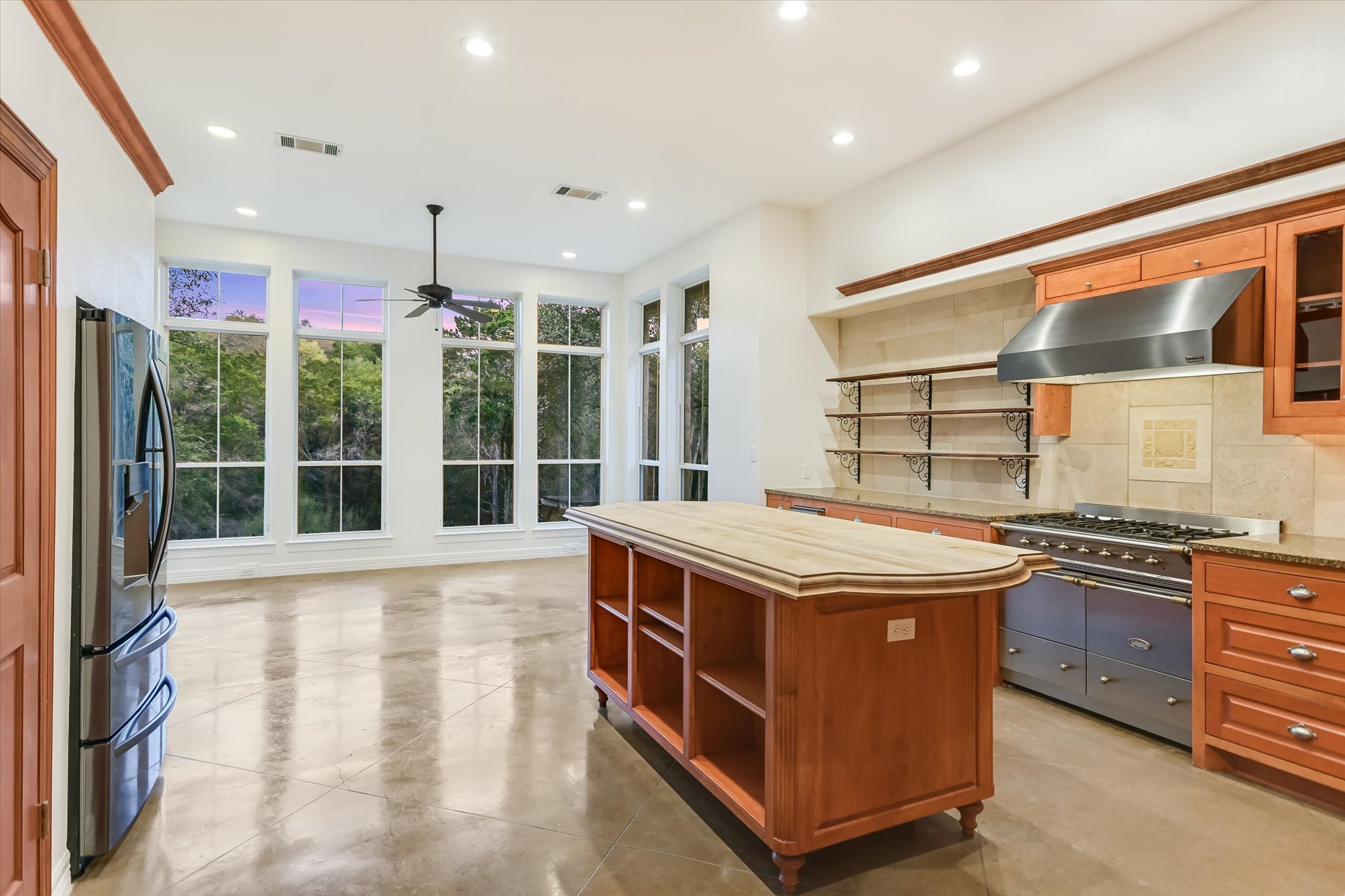 4501 House Of Lancaster Austin, TX 78730 - Photo 14 of 36 a kitchen with stainless steel appliances granite countertop a stove and a sink