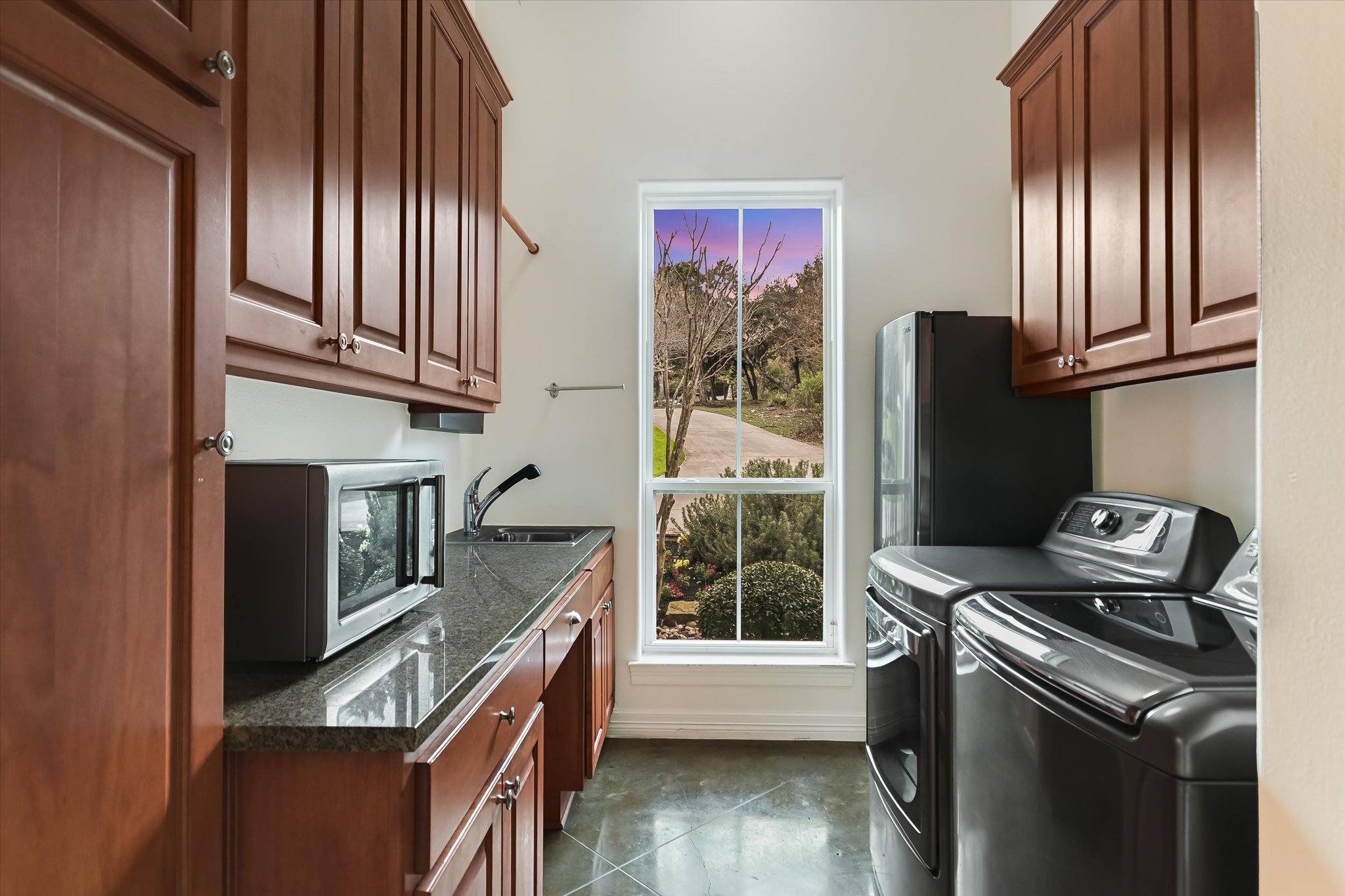 4501 House Of Lancaster Austin, TX 78730 - Photo 16 of 36 a kitchen with stainless steel appliances granite countertop a refrigerator a stove and a sink