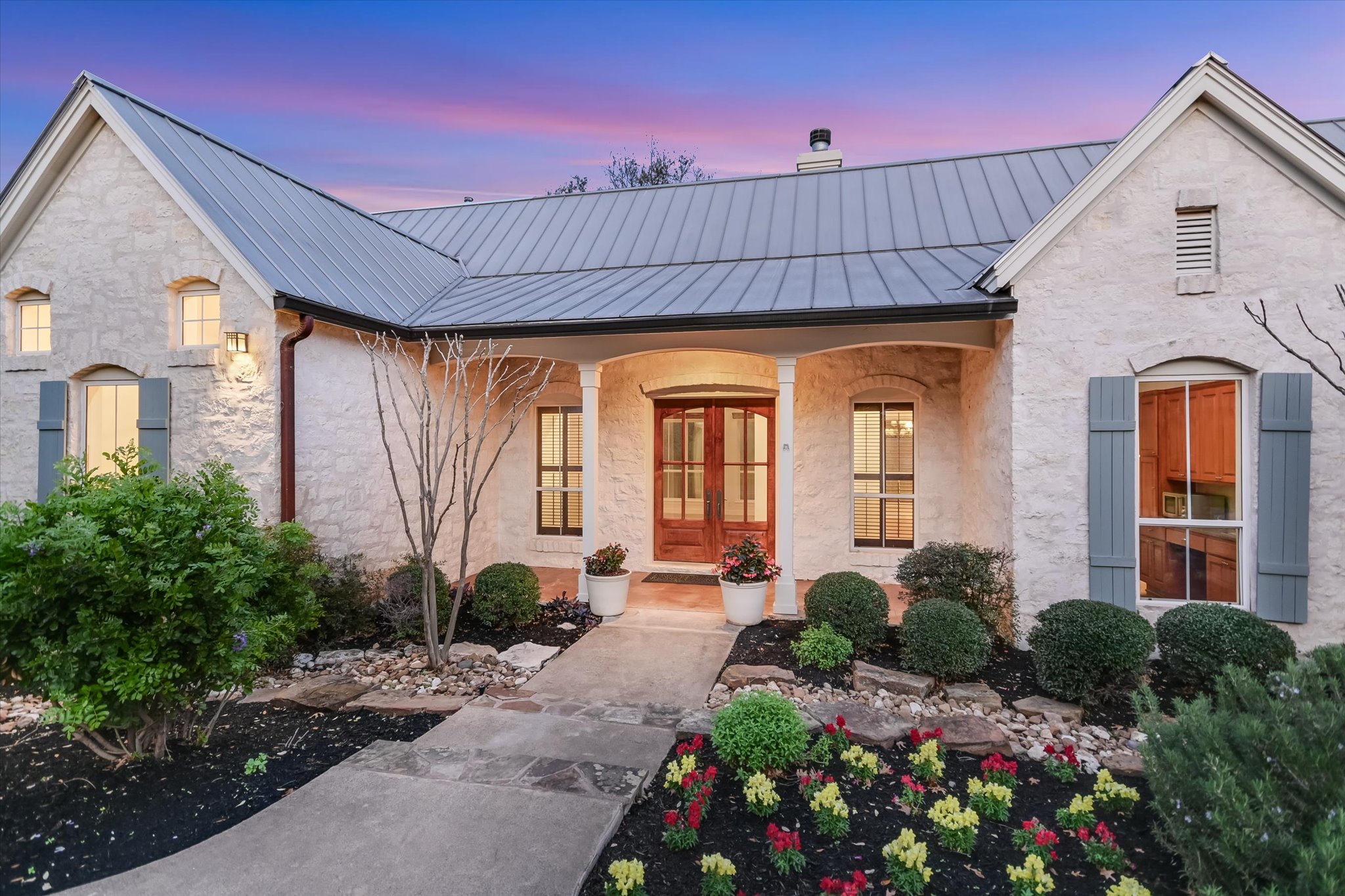 4501 House Of Lancaster Austin, TX 78730 - Photo 2 of 36 a front view of a house with garden