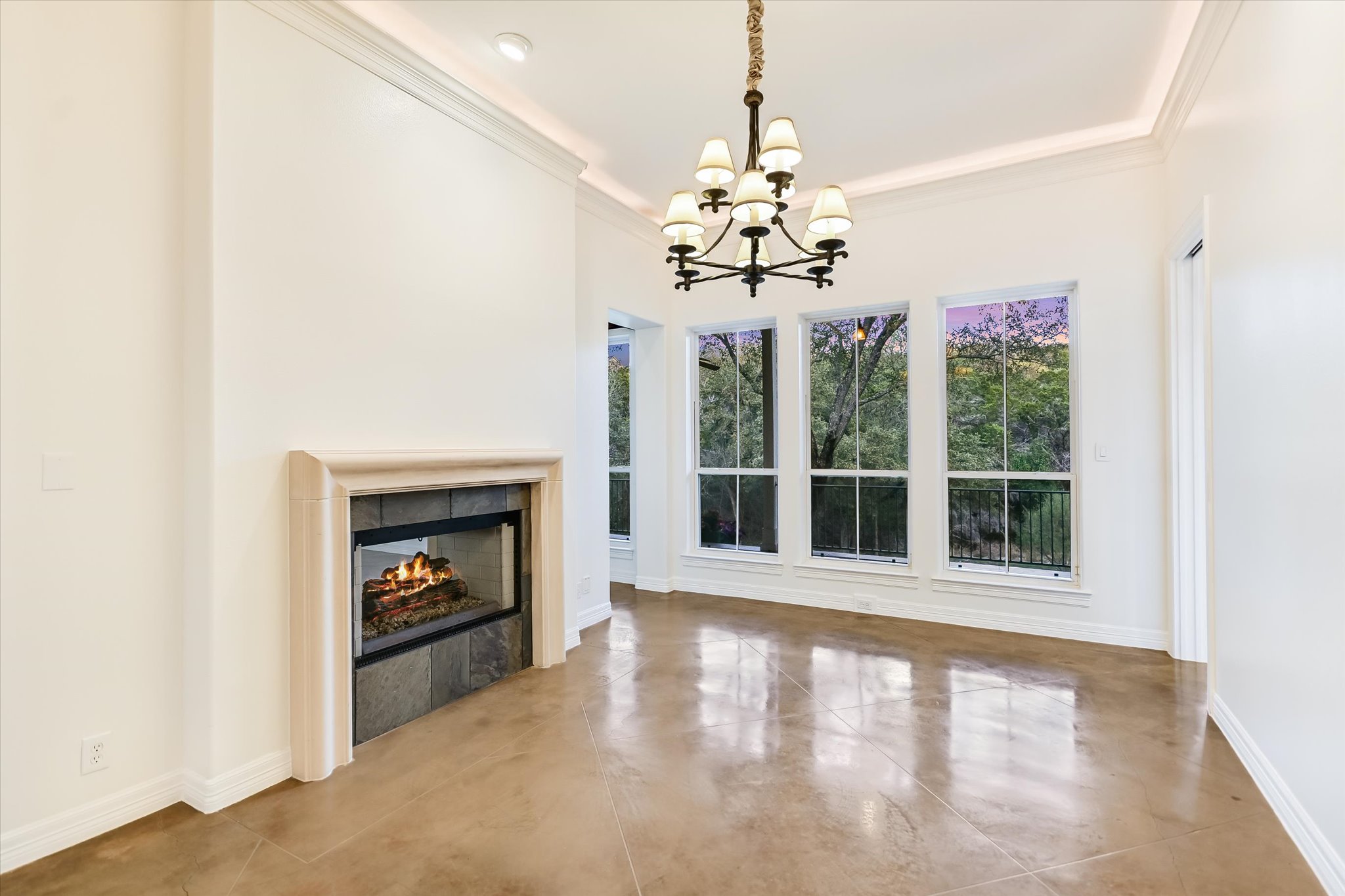 4501 House Of Lancaster Austin, TX 78730 - Photo 8 of 36 a view of a livingroom with a chandelier and fireplace