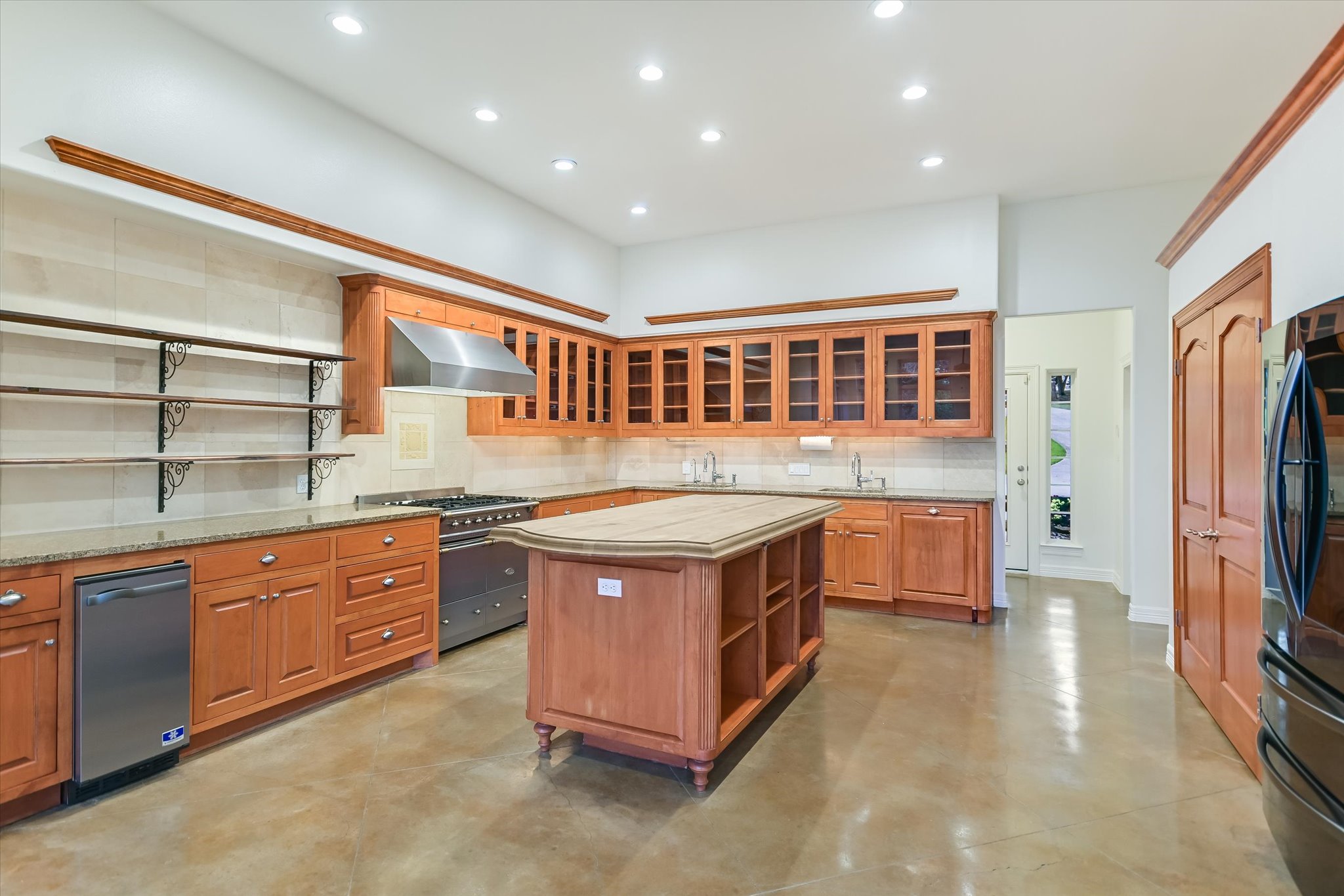 4501 House Of Lancaster Austin, TX 78730 - Photo 10 of 36 a kitchen with stainless steel appliances granite countertop a stove and a refrigerator